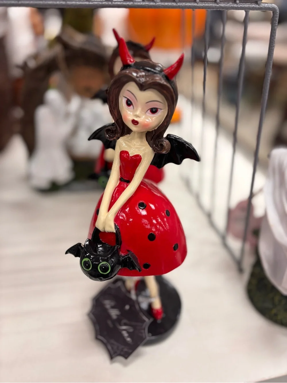 Red Devil Girl Figurine with Bat Accessory